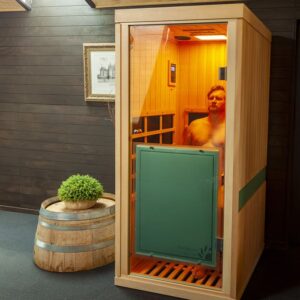 Man sitting with eyes closed during infrared sauna session