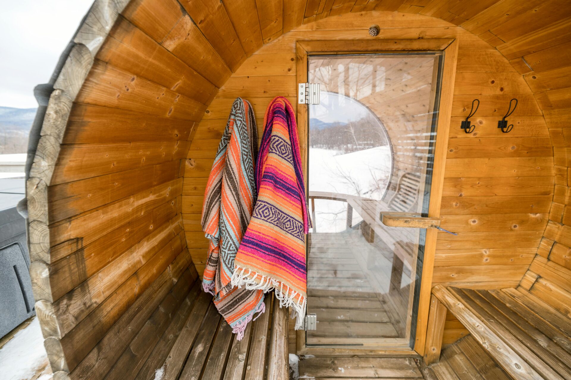Outdoor infrared saunas offer natural settings, while indoor saunas provide convenience.