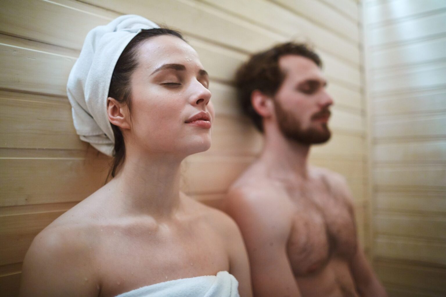 Couple sweating in home infrared sauna