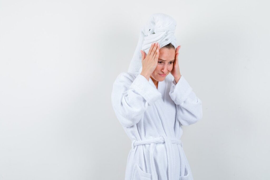 Woman with brain fog, in need of infrared sauna session to improve mental clarity