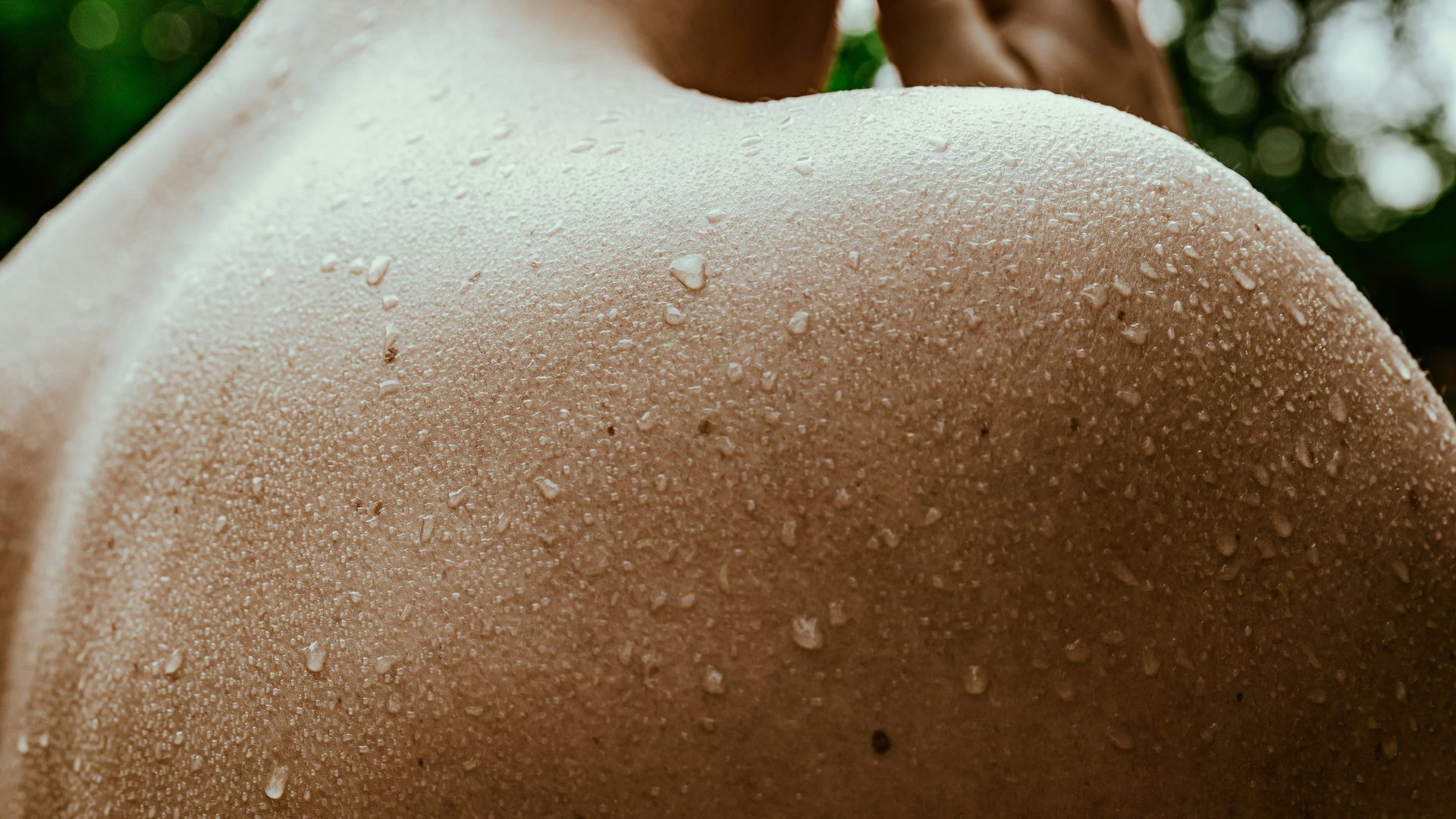 Sweating skin after an infrared sauna session to boost natural skin health